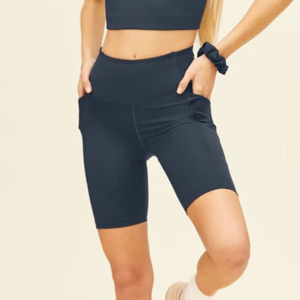 Girlfriend Collective pocket bike short in color moon or grey / gray